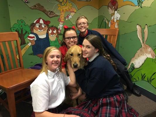 Students and families participate in training Service Dogs with the Lone Star Puppy Raisers. Great shot of the Library mural too!