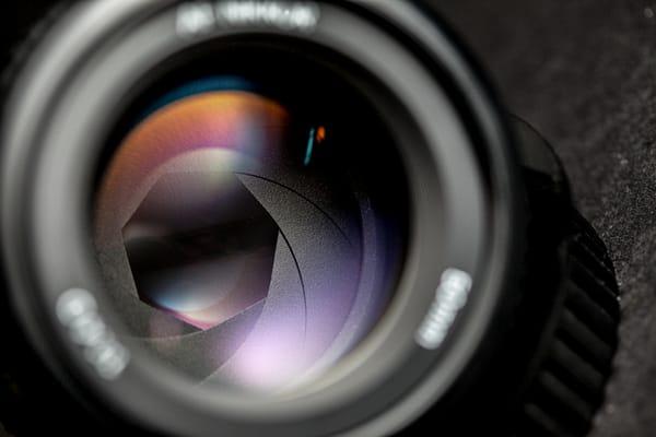 The aperture of a camera lens.