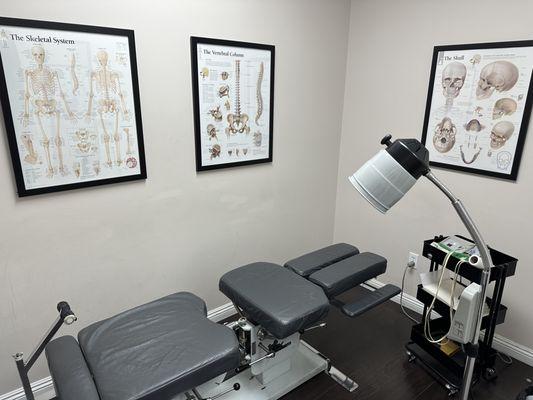 Treatment room seen with an infrared heating lamp and electric stimulation modalities