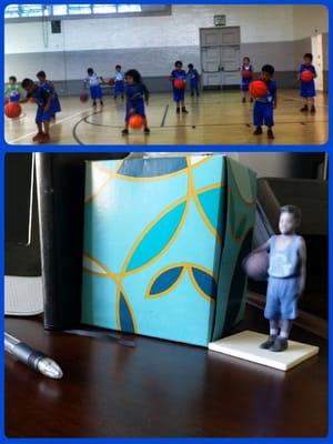 My little guy on my desk in his basketball uniform