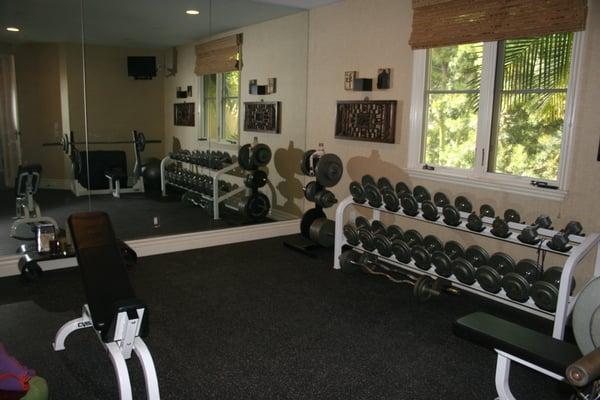 Installed a rubber gym floor in a home gym.