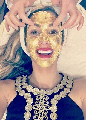 A client getting the 24k Gold Facial, an anti-aging treatment that stimulates collagen & leaves a long lasting glow