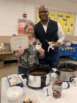 Chili cook-off December 2018. Pastor with the Winner, Amy.