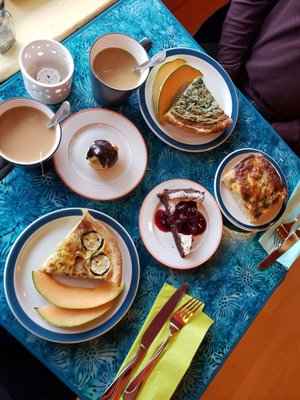 Spinach and zucchini Quiche,  cream puff, focaccia bread,  and chocolate torte with tea & coffee