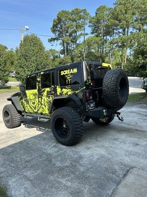 Scream n it pennywise ghostface jeep wrangler vinyl wrap 3m satin black avery lime green vehicle vinyl wrap STW Wraps and Graphics