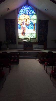 Our beautiful stained glass window in our peaceful sanctuary.