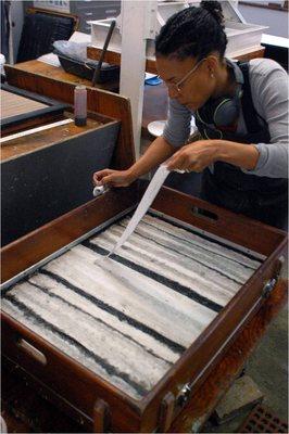 Artist-in-Residence, Karen J Revis, working on pulp paintings in WSW's papermaking studio.