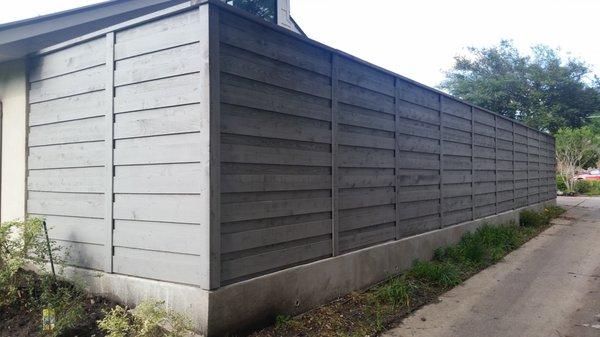 basic concrete retaining wall and horizontal fence