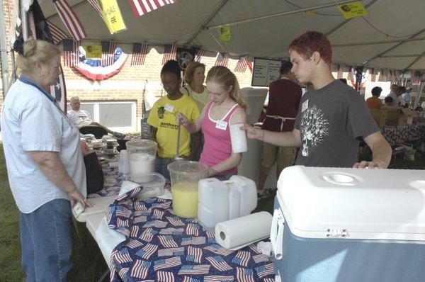 Parish Volunteers making fresh squeezed Lemon Shakes Ups - A Festival Favorite!