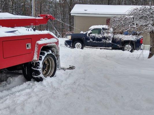 Dual line winching a truck that slid into a house. By using dual cables we were able to avoid further damage