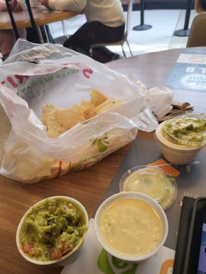 Tortilla chips, guacamole, queso