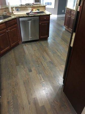 Refinished floor with custom stain