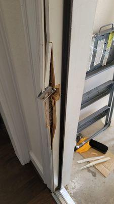 broken door frame do to a kick-in