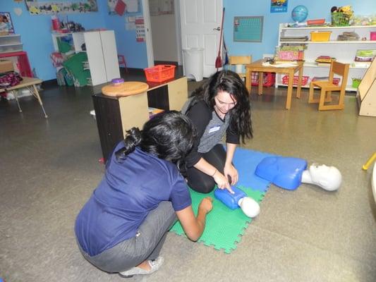 Instructor Coaching A Student On Infant CPR!