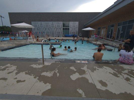 Shallow pool. From 1ft to 3ft depth. Has a ramp entrance for accessible needs. Lifeguards on duty. ~35 ft square.