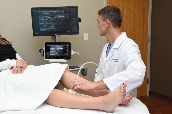 Vein Doctor working with patient