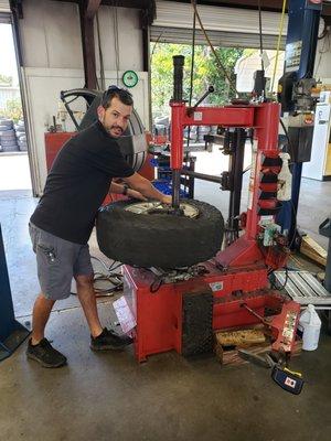 Raymond changing my tires.