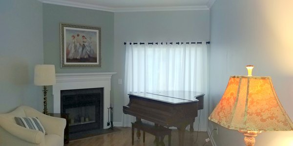 Complete room design with oak hardwood flooring , new color scheme,  crown molding, and window treatments