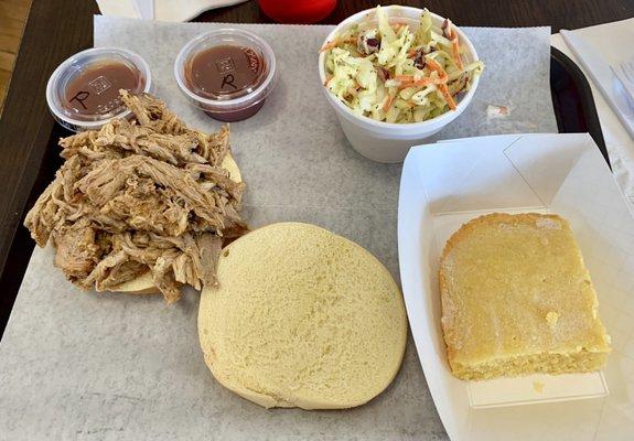 Pulled pork sandwich w/cornbread and mustard slaw.