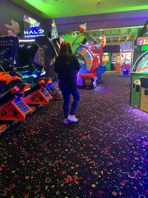 Employee walking away from bumper cars while talking on the phone leaving the bumper cars unattended