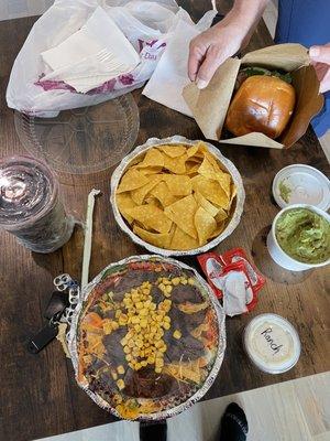 BLT sandwich, guacamole and chips, and crispy tortilla salad with steak