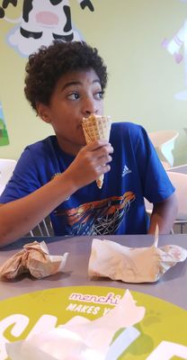 Aiden loves waffle cones at Menchie's!!