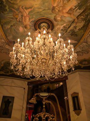 tons of beautiful chandeliers throughout the house