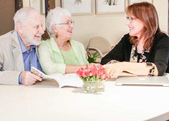 Hilarie Kavanagh, Medicare Licensed Agent, helping her Medicare clients at the Lafayette office.