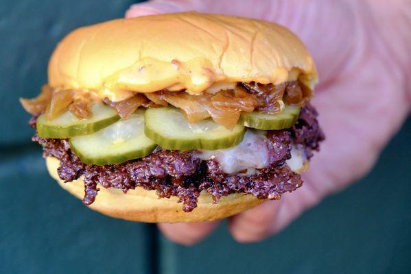 Smash burger with togarashi mayo homemade pickled cucumbers