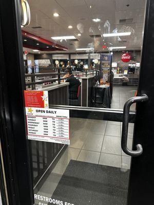 Employee sitting on phone at 9pm with door locked