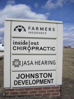 Logos applied to office complex monument sign.