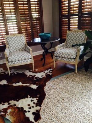 Reupholstery of vintage painted chairs in Kravet fabric; add stone top table and jute rug from Fibreworks