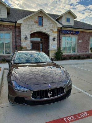 The Maserati looks great under the Feizy Law sign.