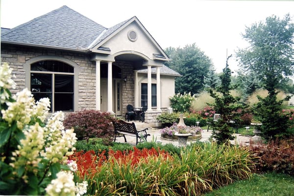 Front yard landscape with seasonal color through the summer.