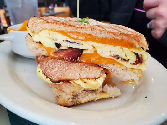 Bacon egg and cheese breakfast panini sandwich