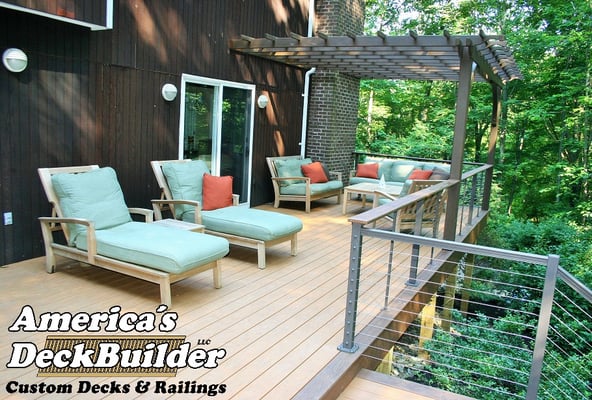 Custom Cedar pergola demands relaxation on this composite deck with stainless steel cable railing in Holmdel, New Jersey.