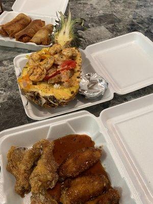 Pineapple bowls with Grilled Chicken or Shrimp. Chicken wings, Philly cheesesteak egg rolls!