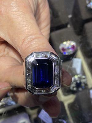 Sapphire with diamond bezel and with white gold setting ring.