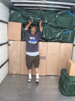 Here is one of our foreman packing the truck. Everything protected properly and evenly distributed to go into storage.