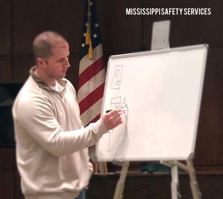 Instructor Rylon draws examples for local class in Madison, MS.