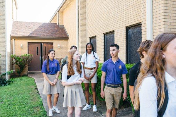 Secondary students headed to have class outside.