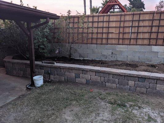 Backyard wall, the previous bed was just held up with rotted boards.