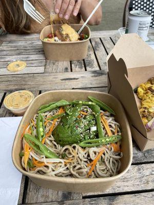 $19 The soba of the Salmon Soba Salad. Salmon in back on $16 Greek Salad. Generous portion. Miso salad dressing