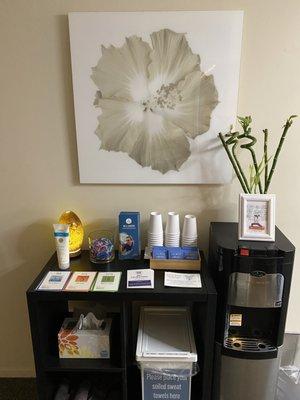 water station with teas and hair ties and towels