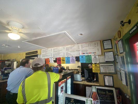 The lunch line. Menu on wall is a bit disorganized but it still works