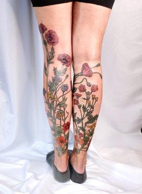 Botanical flower leg tattoo