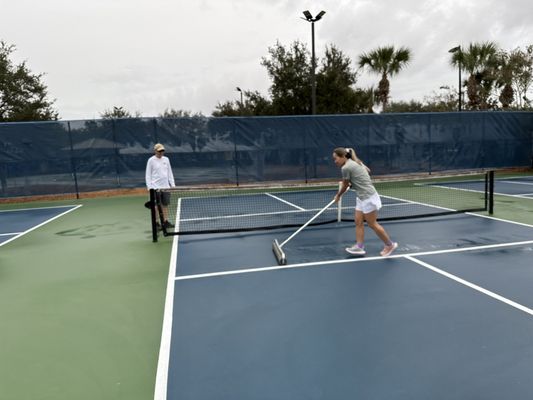 Giant squeegee to get the standing water off of the court.