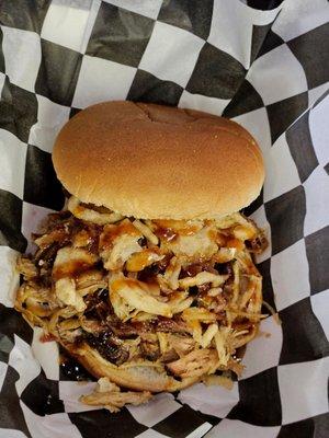 Pulled Pork sandwich with our own peach bbq sauce and french fried onions