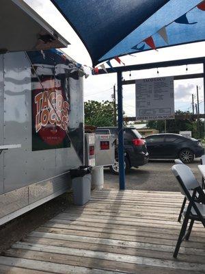 Taco truck and seating area.