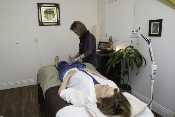 Diane Doing Acupuncture on Patient